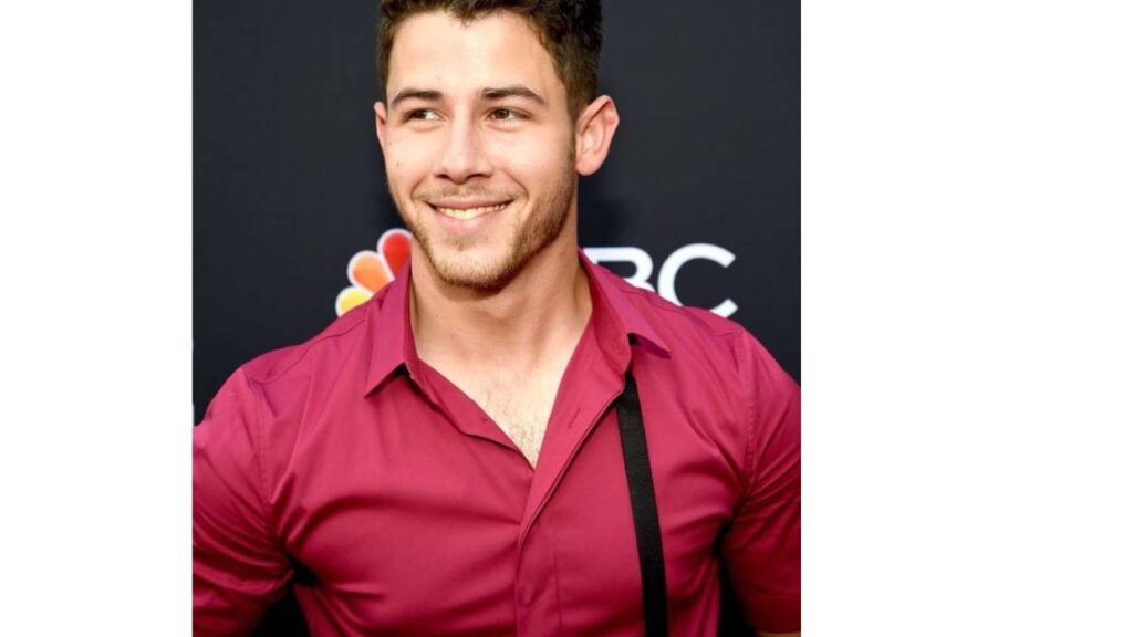 Image Of Nick Jonas & reference of how Nick Jonas wore compression shirt to hide gyno -puffy nipples- (which is one of the symptoms of gynecomastia)
